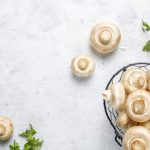 Fresh organic white mushrooms champignon,top view